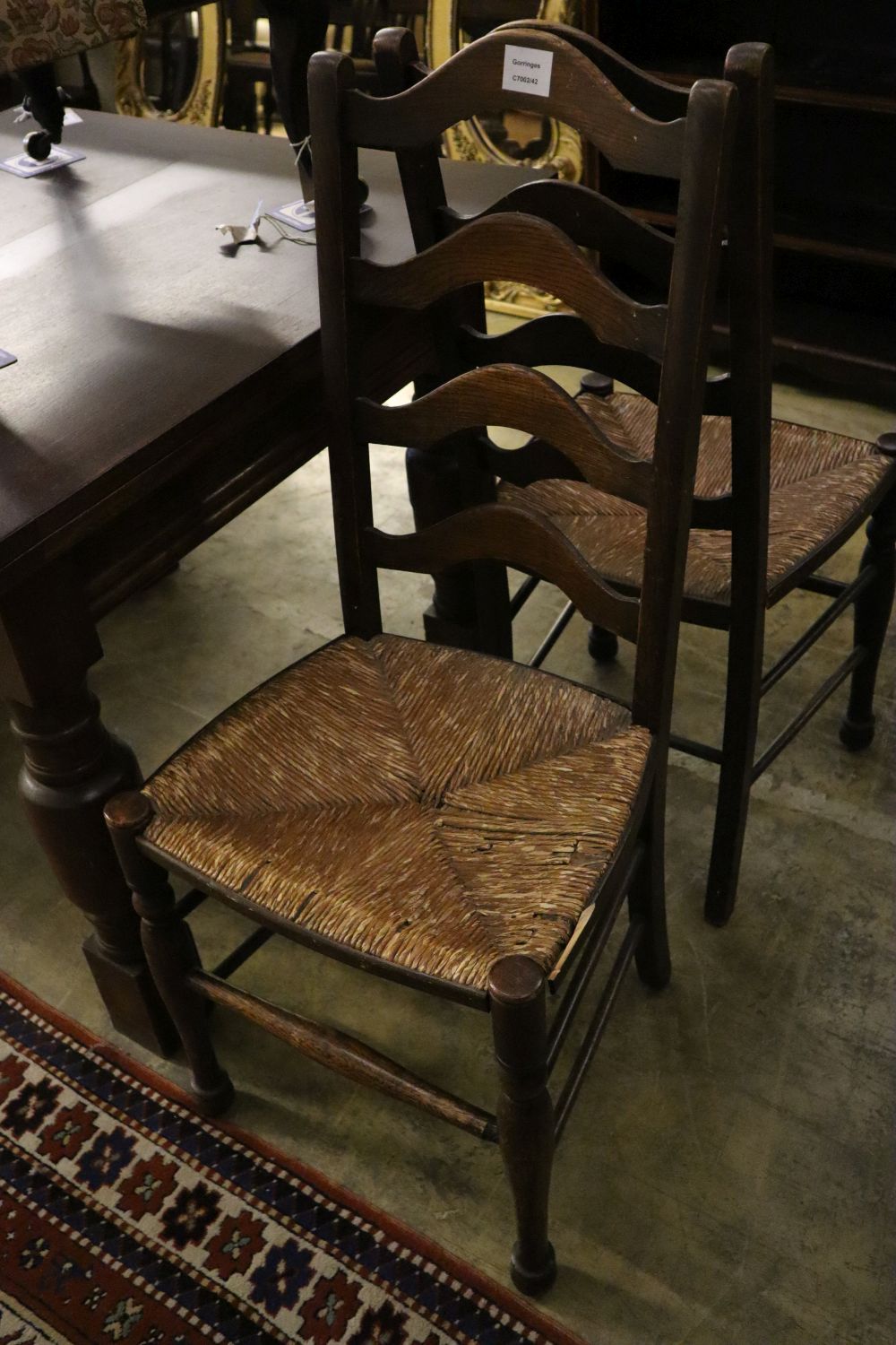 A pair of 19th century ladder-back oak chairs with rush seats